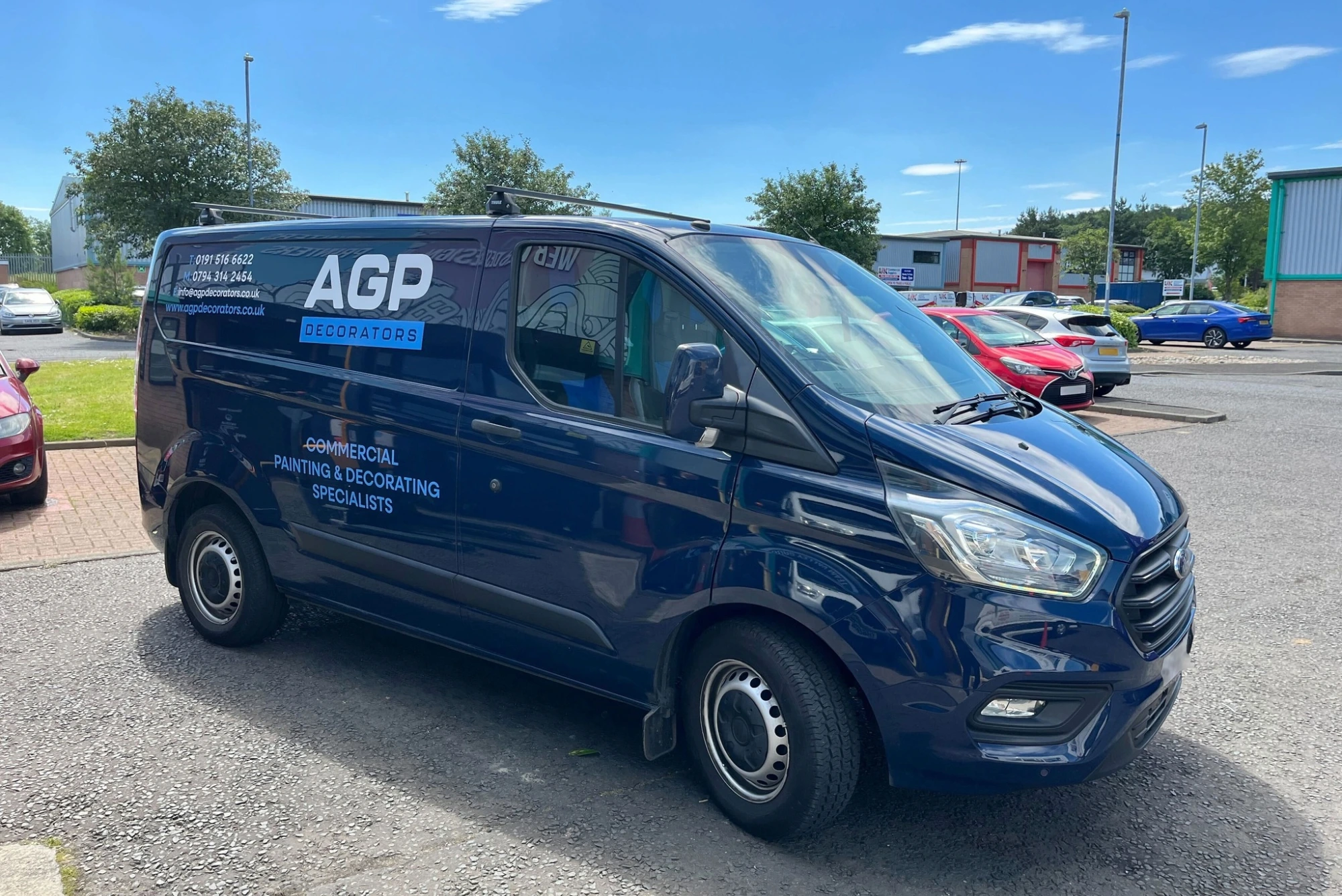 Image of a blue van after getting graphics stuck on by the Team Valley Printers team.